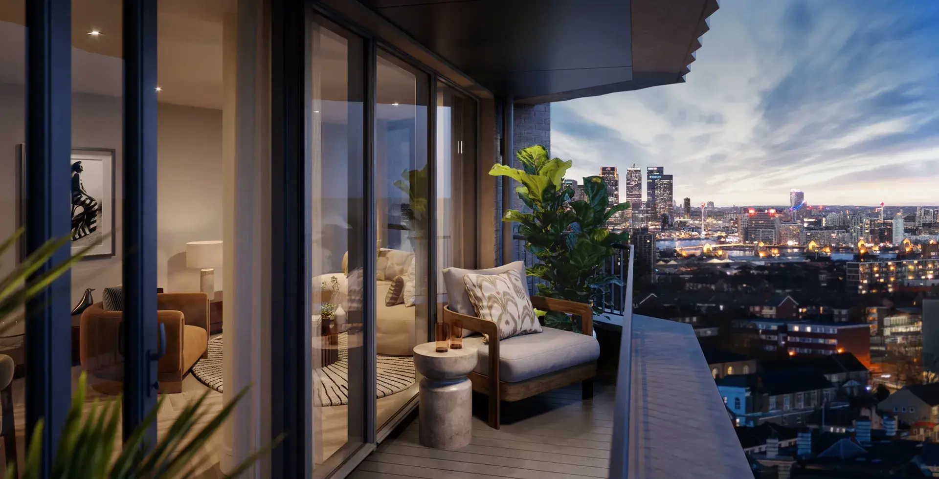 London Square Woolwich render showing a furnished balcony with a lounge chair and plant, overlooking the London city skyline at dusk