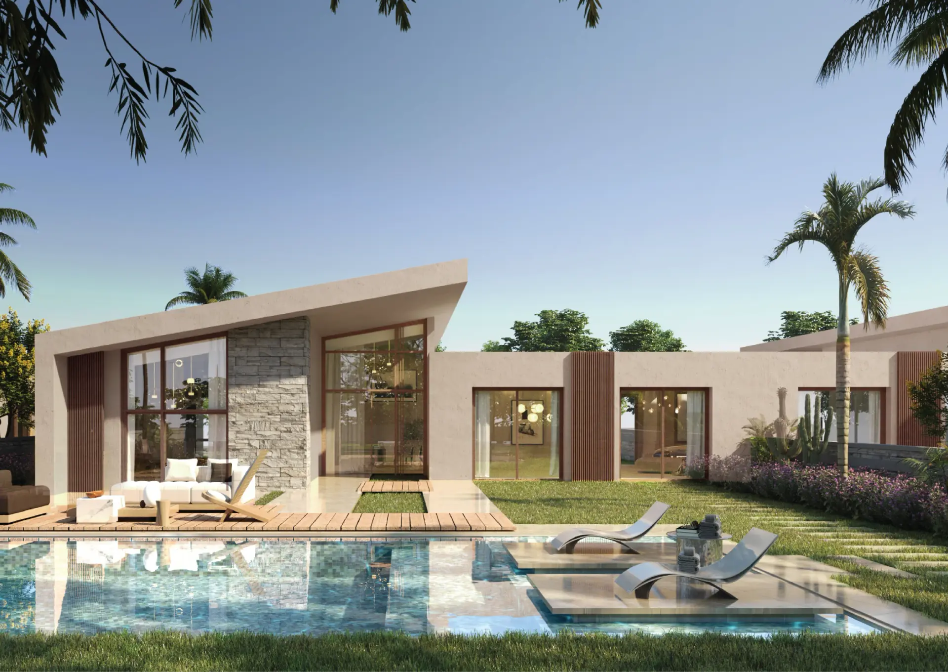 Single-story twin villa with an angled roofline, stone-clad wall, and large glass windows, set behind a private pool with sun loungers, a wood deck, and landscaped garden.